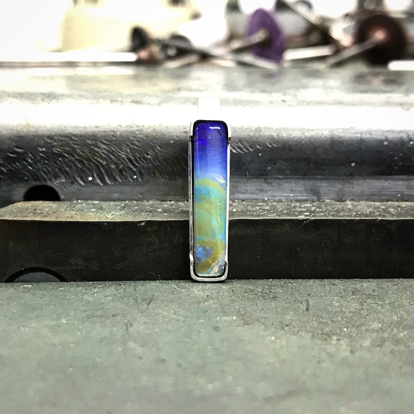 Queensland Boulder Opal pendant with 45cm long silver chain. Opal is set in delicate silver frame. This opal is a picture opal and resembles an image of earth taken from space. Green and Blue Boulder opal sourced from ethical local Queensland mine. High quality Australian made and handcrafted