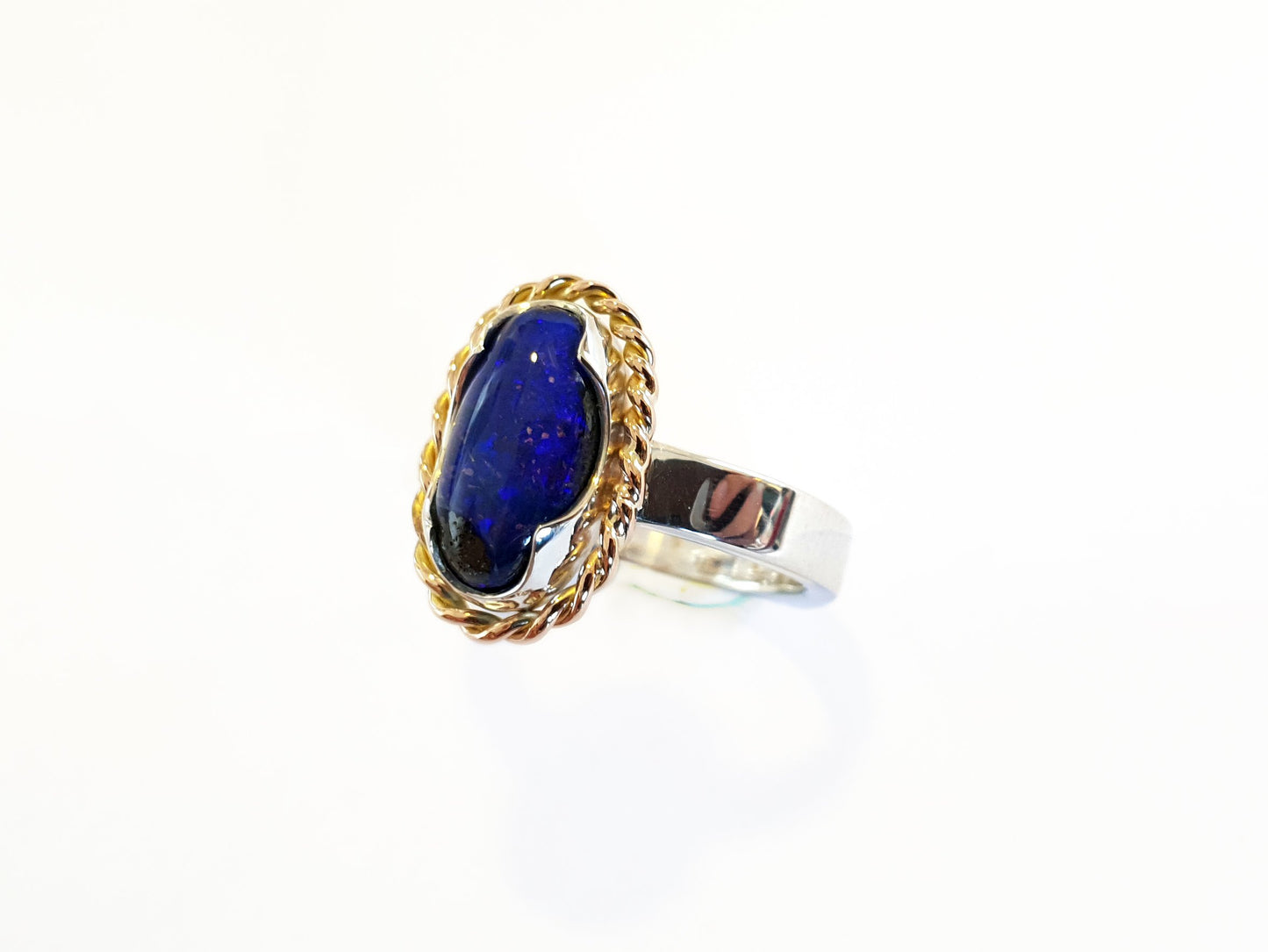 9ct rose gold twist and silver band with a blue Queensland Boulder Opal. Australian made and handcrafted using local and ethical products.