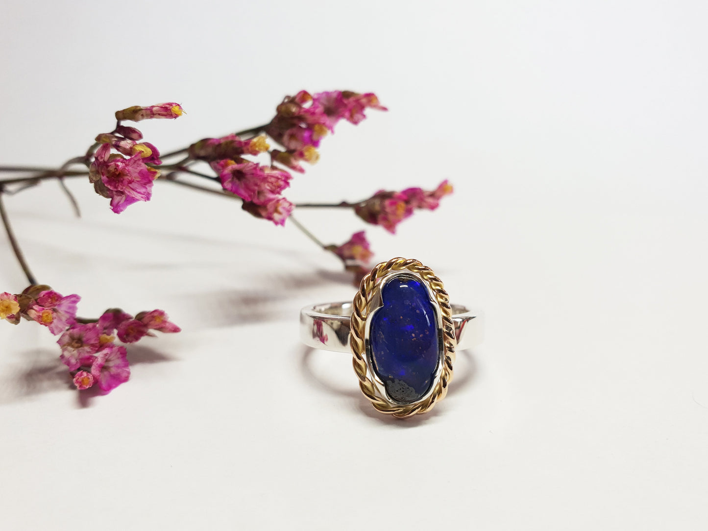 9ct rose gold twist and silver band with a blue Queensland Boulder Opal. Australian made and handcrafted using local and ethical products.