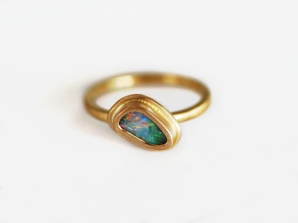 22ct yellow gold queensland boulder opal ring. Brushed finish. Australian made with ethically sourced products and handcrafted in our Brisbane studio. Opal is green and pink
