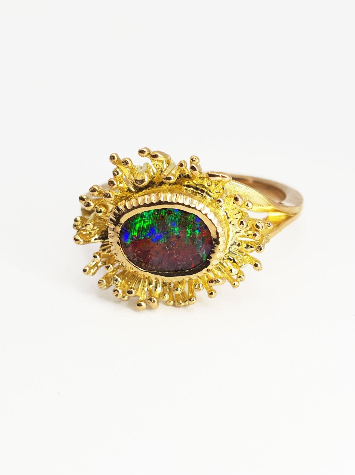 Gold fringe ring with Queensland Boulder Opal. This opal resembles the aurora with greens, reds, blues and purples. Our products are all made with ethically sourced materials and handcrafted in our Brisbane based studio. Australian made and designed for high quality fine fashion