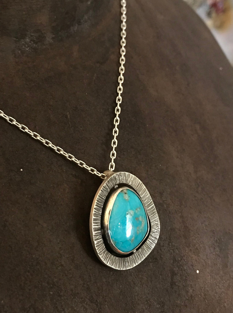 Natural and Silver Turquoise Pendant. Blackened Silver Pendant. Turquoise is framed by a handcrafted halo. Australian made and designed, hand crafted using ethically sourced materials for a unique high quality piece. 