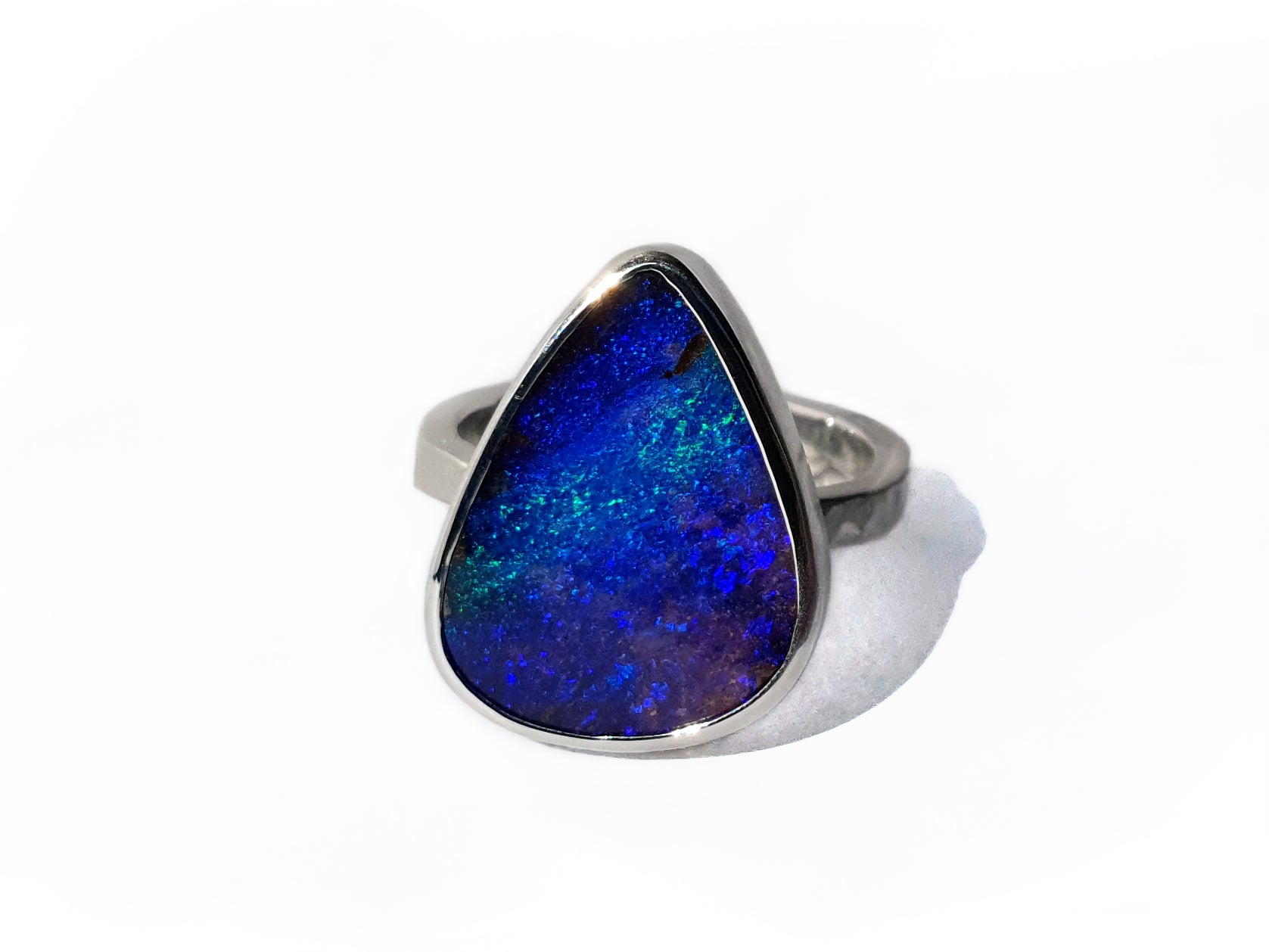 Blue and purple Queensland Boulder Opal set in Silver band. This ring is handcrafted using ethically sourced materials in our Brisbane studio.