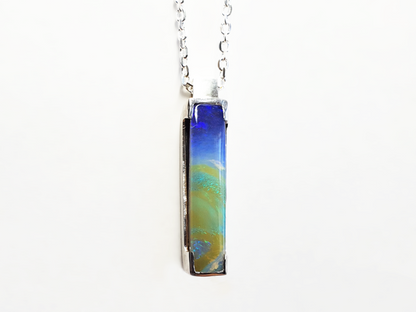 Queensland Boulder Opal pendant with 45cm long silver chain. Opal is set in delicate silver frame. This opal is a picture opal and resembles an image of earth taken from space. Green and Blue Boulder opal sourced from ethical local Queensland mine. High quality Australian made and handcrafted