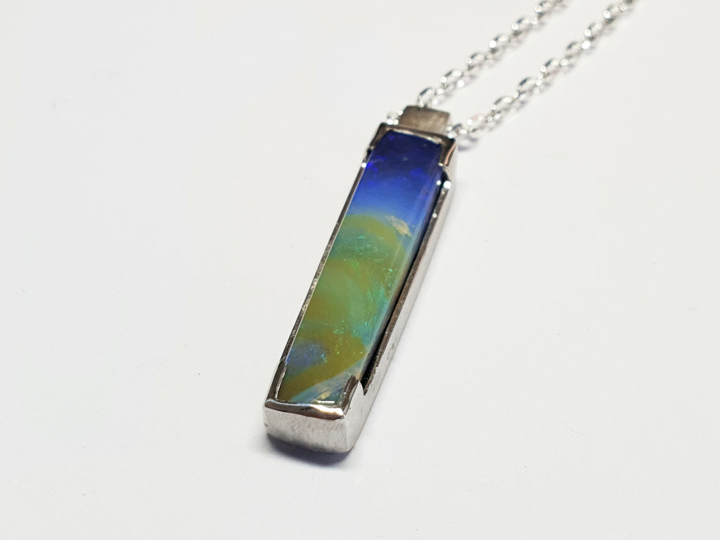 Queensland Boulder Opal pendant with 45cm long silver chain. Opal is set in delicate silver frame. This opal is a picture opal and resembles an image of earth taken from space. Green and Blue Boulder opal sourced from ethical local Queensland mine. High quality Australian made and handcrafted
