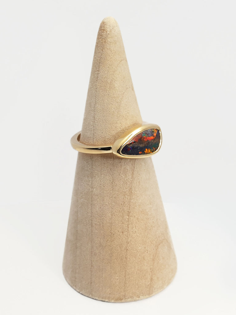 18ct yellow gold polished gold ring with Queensland boulder opal. Opal flashes red, blue, green and purple. Australian designed and Australian made for a high quality finish. Ethical and fine fashion by Custom Jewellery Co by using ethically sourced local products and handcrafted in our Coastal Queensland Studio