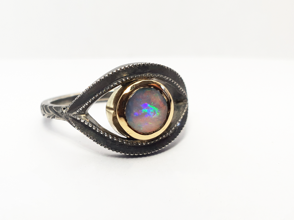 Mystical, Alternate, Gothic ring with pink and purple Queensland Boulder Opal set in blackened Silver in the shape of a mystical eye. This unique ring is handcrafted and Australian designed and made for a high quality finish. We believe in fine, high quality jewellery and use only ethically sourced materials