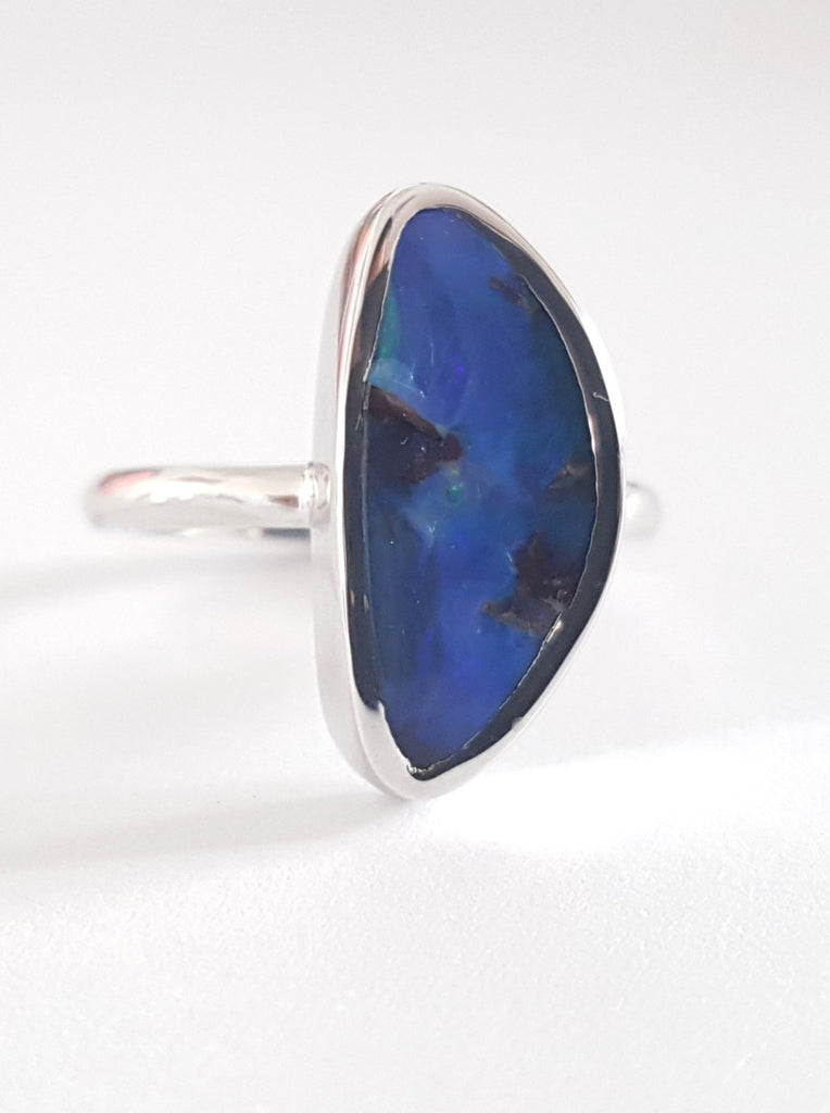 Blue Queensland Boulder Opal set in polished silver band. This ring is Australian made and handcrafted in our Brisbane studio using ethically sourced materials. 