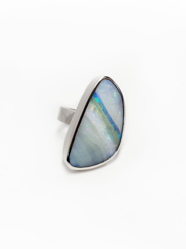 Solid Silver Queensland Boulder Opal ring. Australian made and handcrafted in our brisbane studio, this bright ring has streaks of blues and pinks throughout, resembling a rainbow. 