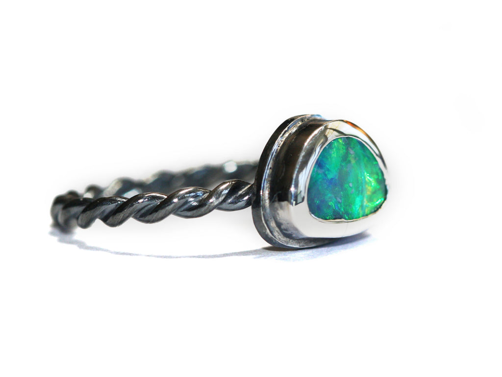 Blue and Green Queensland Boulder Opal set in polished, twisted silver. The ring is Australian made and handcrafted in our Brisbane studio using ethically crafted materials. 