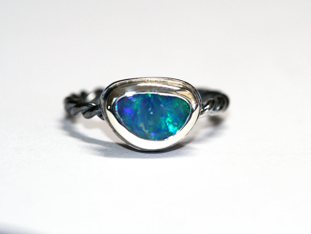 Blue and Green Queensland Boulder Opal set in polished, twisted silver. The ring is Australian made and handcrafted in our Brisbane studio using ethically crafted materials. 